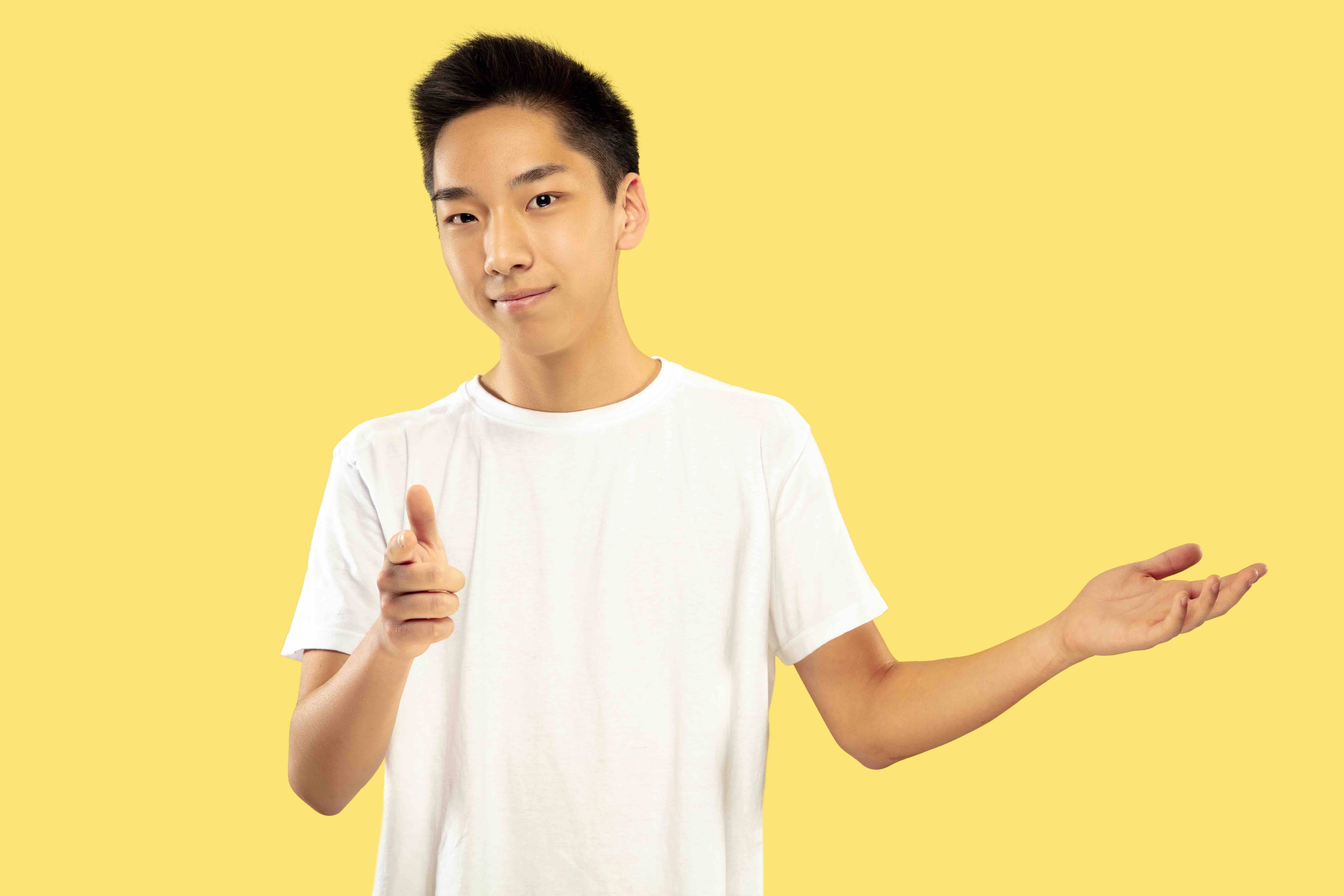 korean-young-man-s-half-length-portrait-yellow-wall YTL